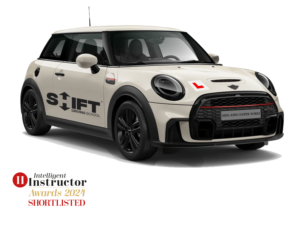 Shift Driving School's Cream Mini Cooper D with Shift Decals.